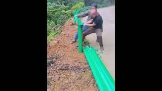 Highway curve safety guardrail construction