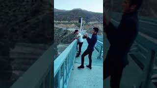 GUY THROWS ROCK INTO WATER