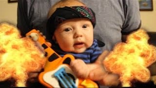 Cutest metal band video ever! Baby plays air guitar like a boss!